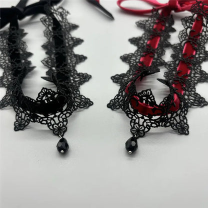 Collier ras du cou en velours noir avec pendentif en forme de goutte d'eau